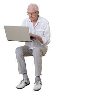 cut out older man sitting and working with laptop