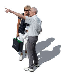 cut out older man and woman standing and pointing at smth