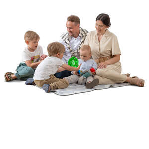 cut out family with three kids playing on the picnic blanket