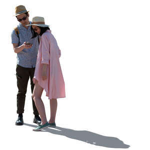cut out backlit asian couple standing and looking at their smartphone
