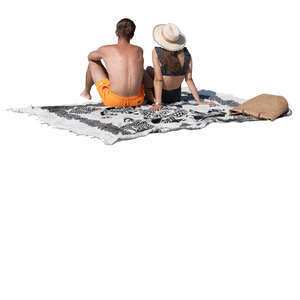 cut out man and woman sitting on the beach