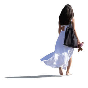 cut out woman in a white dress walking barefoot