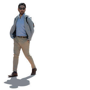 cut out backlit japanese man walking hands in his pockets