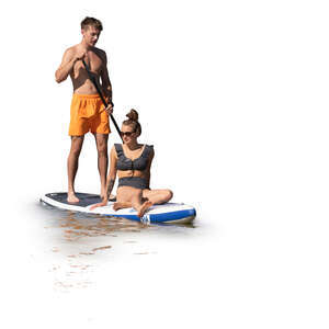 cut out man and woman riding a sup board