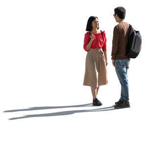two cut out backlit people standing and talking