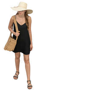 woman in a black summer dress and wearing a hat standing seen from above