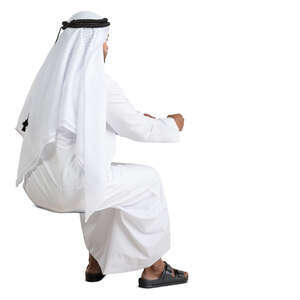 cut out arab man sitting at a desk