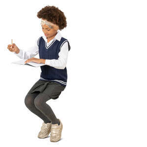 cut out schoolgirl sitting and writing
