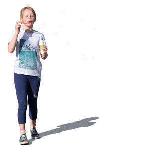 cut out little girl standing and blowing soap bubbles