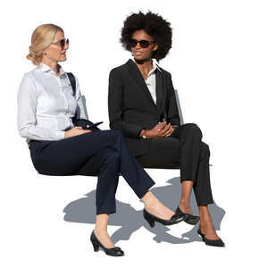 two businesswomen sitting and talking