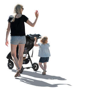 backlit image of a mother and daughter walking