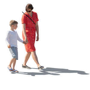 backlit image of a a mother and son walking