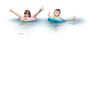 two cut out kids with swim rings playing in the water