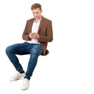 cut out man sitting with a phone in his hand
