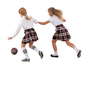 two cut out schoolgirls playing football