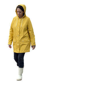 cut out woman in a yellow raincoat walking