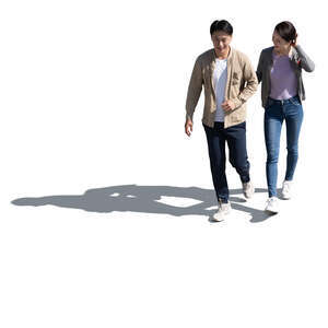 cut out asian couple walking arm in arm seen from above