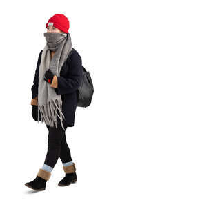 cut out teenage girl with a hat and big scarf walking
