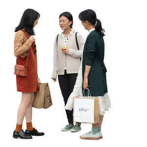 three cut out young asian women standing and talking