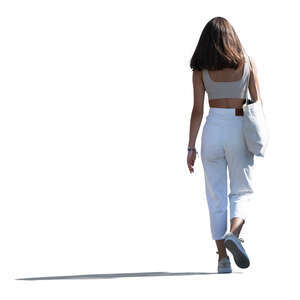 cut out young backlit woman walking