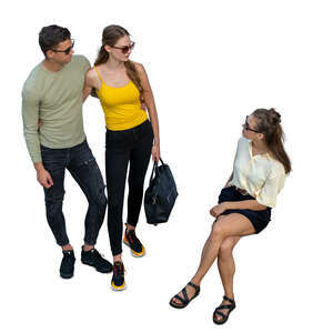 cut out woman sitting and talking to two people standing beside her seen from above
