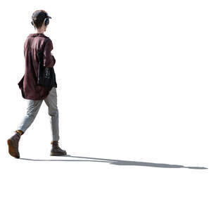 cut out backlit man listening to music walking on the street