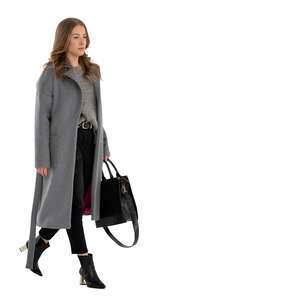 cut out woman in a grey overcoat walking