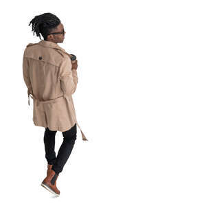 cut out black man in a brown overcoat walking seen from above