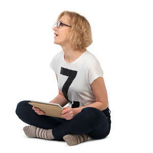 cut out woman with a tablet sitting on the floor and looking up