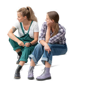 two cut out women sitting on the stairs