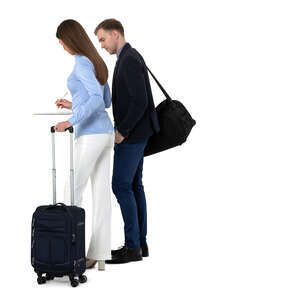 cut out man and woman standing at the hotel reception and filling papers