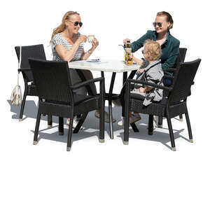 two women and a little boy sitting in a cafe