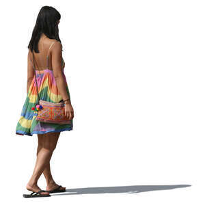 woman in a colorful summer dress walking