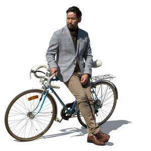 cut out japanese man standing and leaning against his bike