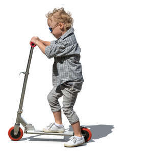 little boy riding a scooter