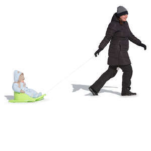 woman pulling a sledge with his baby boy