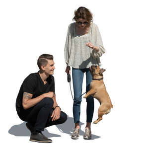 cut out man and woman playing with a dog