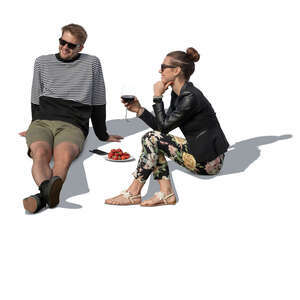 cut out man and woman sitting on a terrace and drinking wine