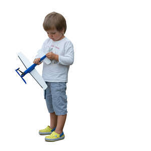 cut out little boy playing with a toy plane