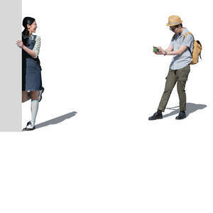 cut out man taking a picture of a woman posing by the wall