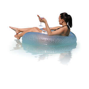 cut out woman relaxing in a pool on a floatie and drinking cocktails