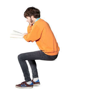 cut out young man sitting and reading a book