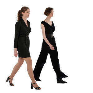 two cut out women in formal black party outfits walking