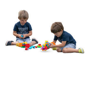 two cut out boys playing with constructor toys