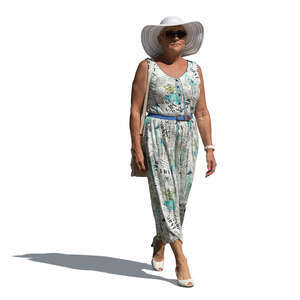 cut out older woman in a summer dress walking