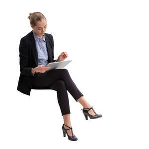 cut out businesswoman with a tablet sitting and working
