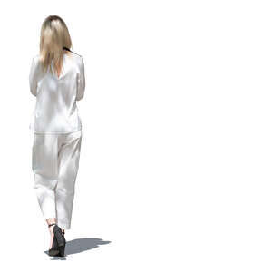 cut out woman in a chic white summer outfit walking