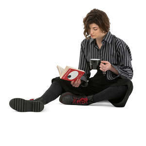 cut out woman sitting on the ground and reading a book