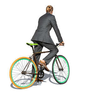 cut out man in a grey suit riding a bike