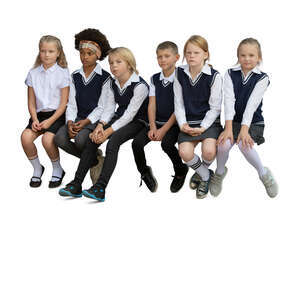 cut out group of school children sitting in a row